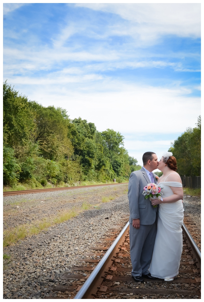Wedding photography bride and groom on railroad tracks at Columbia Station Phoenixville, PA by wedding photographer Silver Orchid Photography