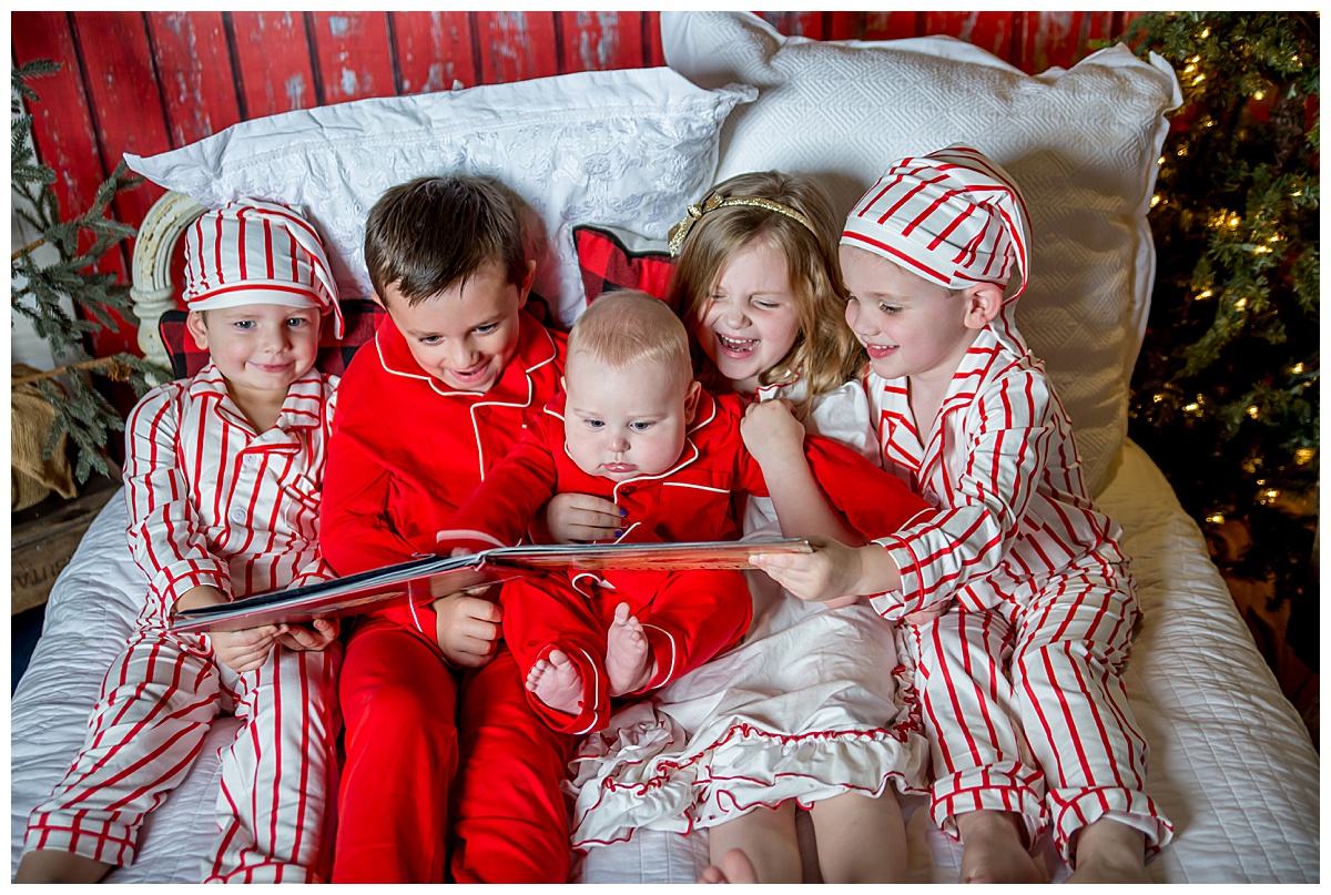 kids reading in christmas pajamas