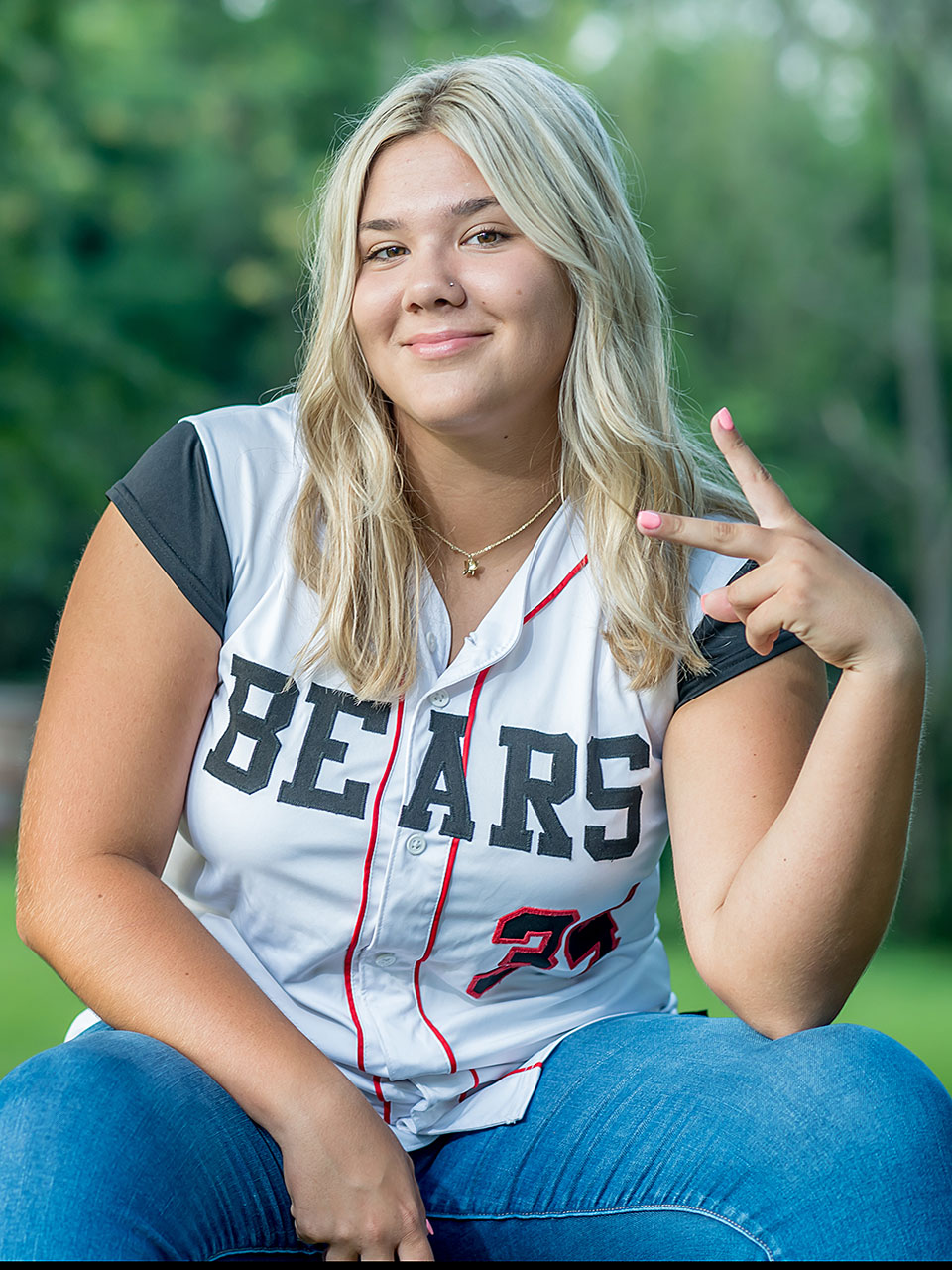 High school senior girl in baseball shirt by Senior photography studio Silver Orchid Photography