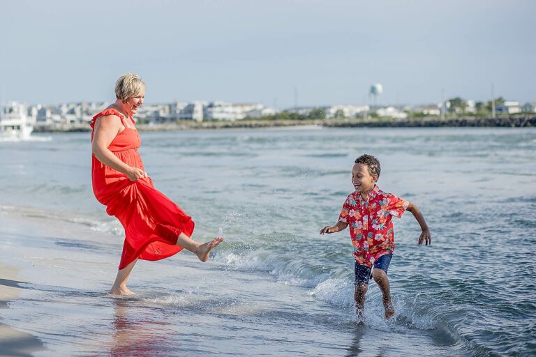 Family beach photo of mother and son at the shore during the Family Beach Photos Experience by Silver Orchid Photography